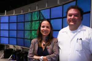 Alessandra Angelucci (left), a University of Utah professor of ophthalmology and visual science, and University of Utah computer science professor Valerio Pascucci stand in front of a computer model of a cluster of neurons scanned from a primate's brain. They have developed software that maps out a monkey’s brain and more easily creates a 3-D model, providing a more complete picture of how the brain is wired. This method of visualizing the brain could help medical researchers better understand what happens to the human brain after it is affected by conditions such as autism, depression, anxiety or retinal degeneration.