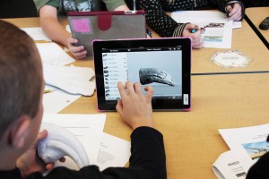 A student manipulates a virtual 3-D model of a bone.