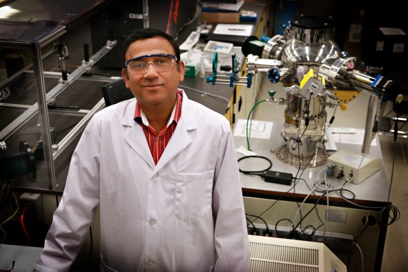 University of Utah materials science and engineering associate professor Ashutosh Tiwari stands in his lab where he and his team have discovered a new 2D semiconducting material made of tin and oxygen. This new material allows electrical charges to move through it much faster than common 3D material such as silicon. This breakthrough in semiconductor material could lead to much faster computers and mobile devices such as smartphones that also run on less power and with less heat.